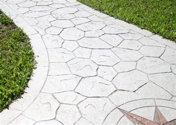 Is stamped concrete cheaper than flagstone?